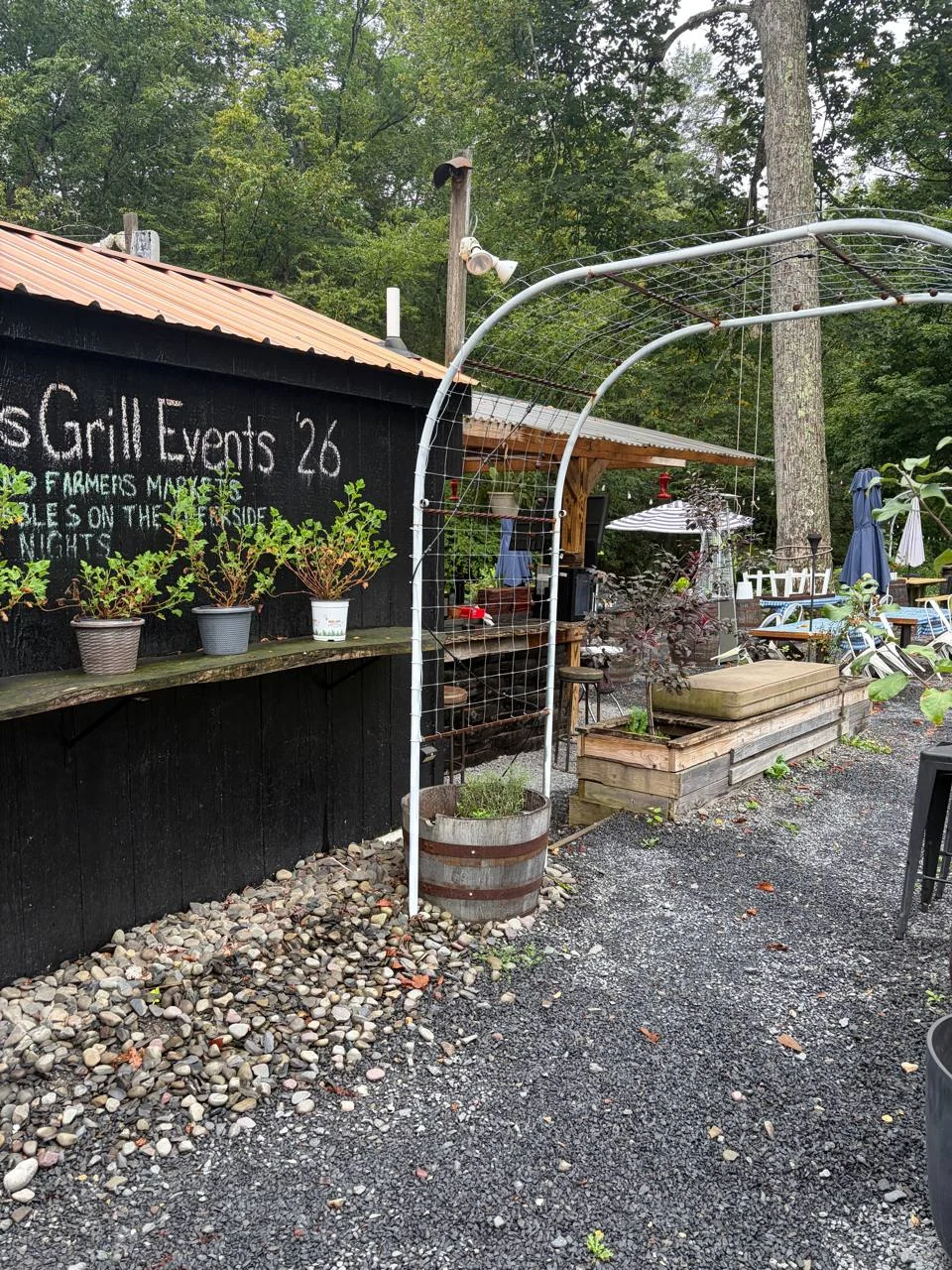Garden arch and outdoor event space at Koby's Creekside Grill