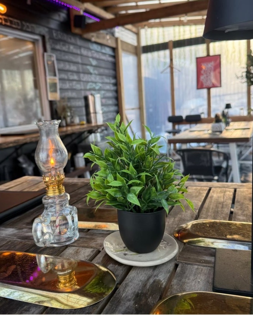 Koby's dining table with oil lamp